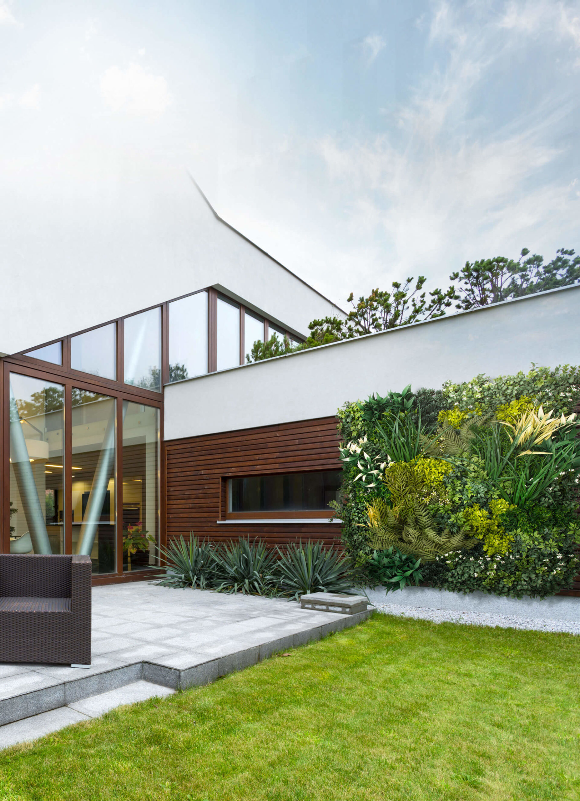 Inside grand entryway with artificial living walls above door