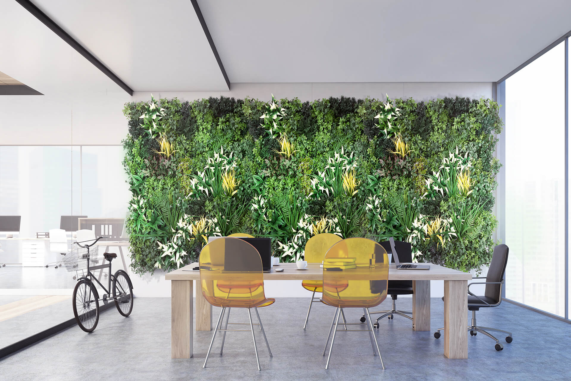 Office with plant wall and yellow desk chairs